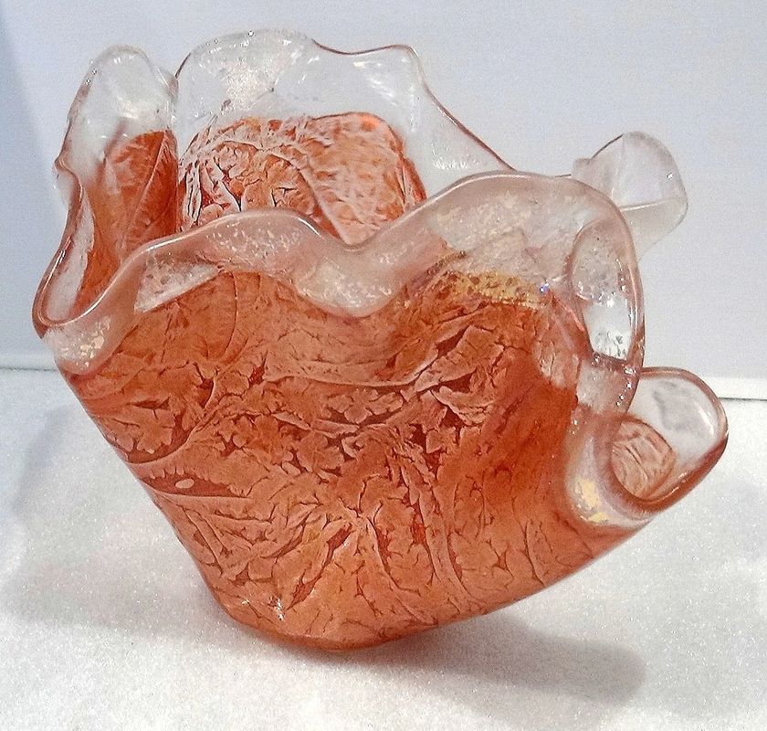 Finished coral-colored kiln-formed glass vessel