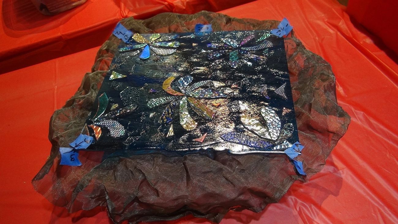 Glass artwork positioned over a freely shaped Miracle Mesh form